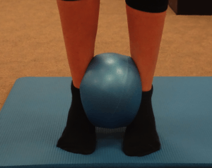 Exercise for ankle using pilates ball